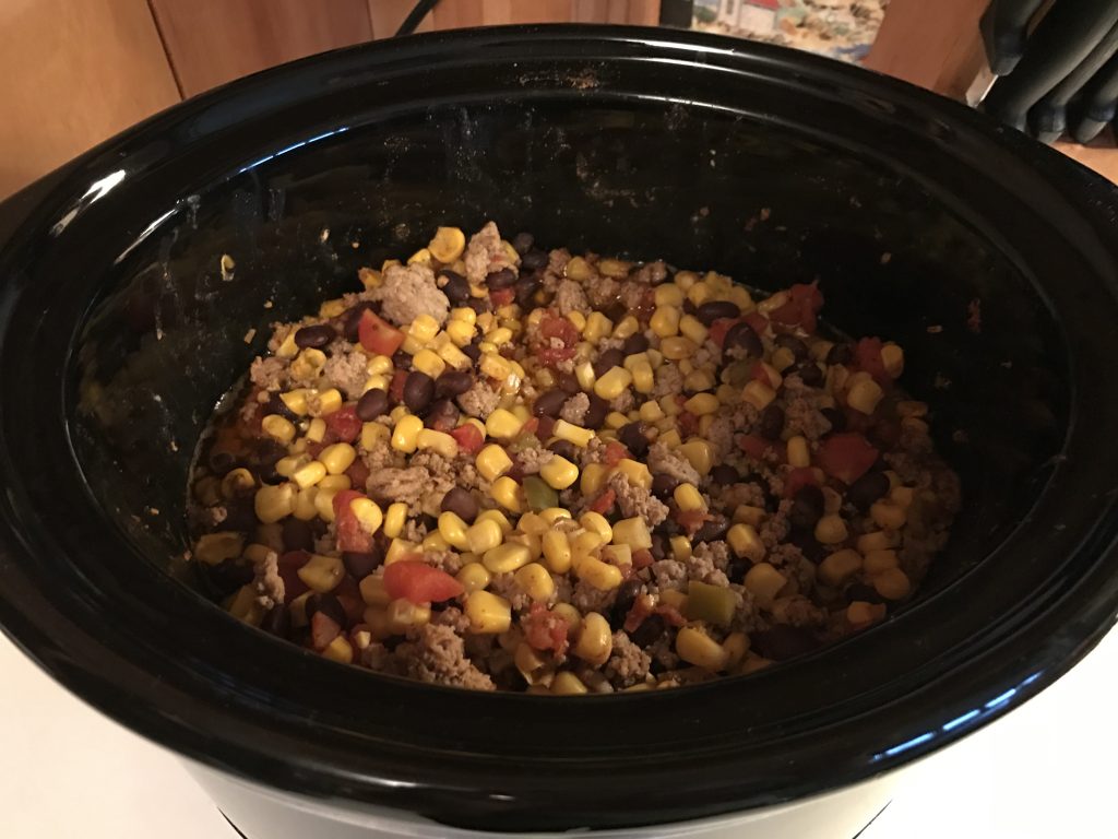 Turkey chili with corn, black beans and rotel in crockpot